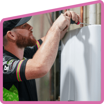 man working on a hot water heater